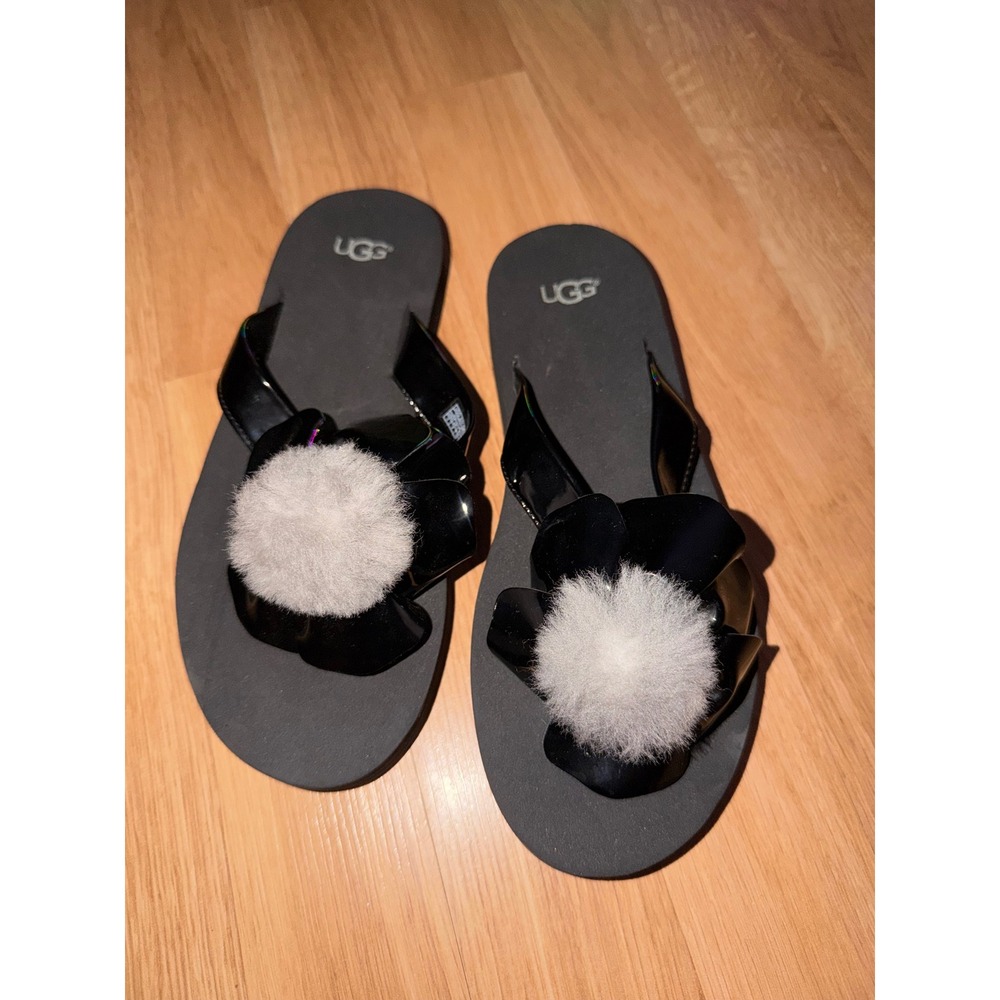 UGG Poppy Black Patent Flower Sheepskin Pom Pom Flip Flop Sandals